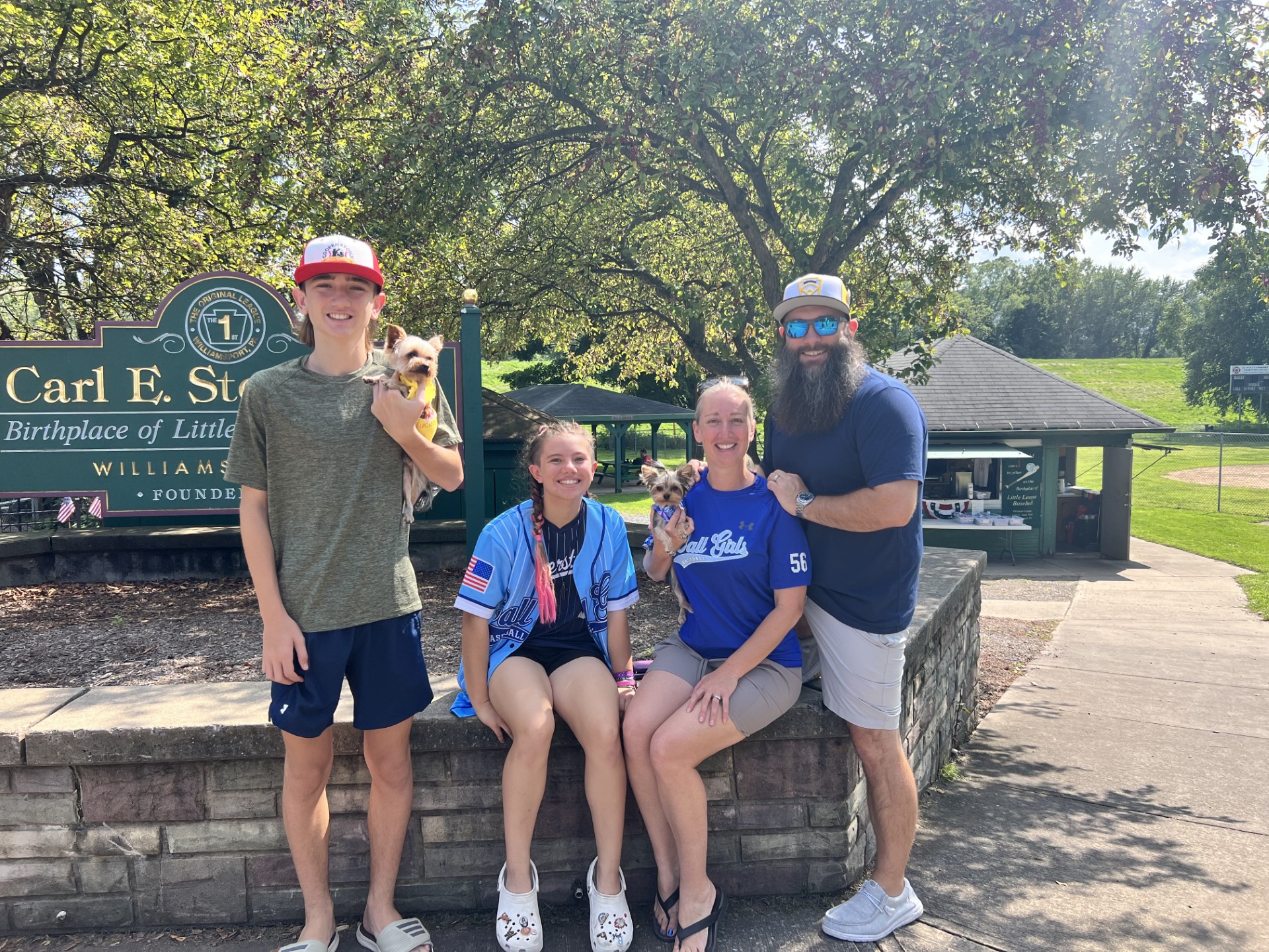 The Gulfview family together outdoors with their two small dogs