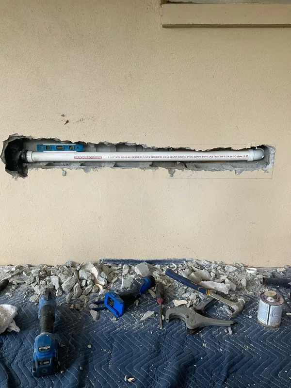 Read the copper waste arm repair story from access through wall patching