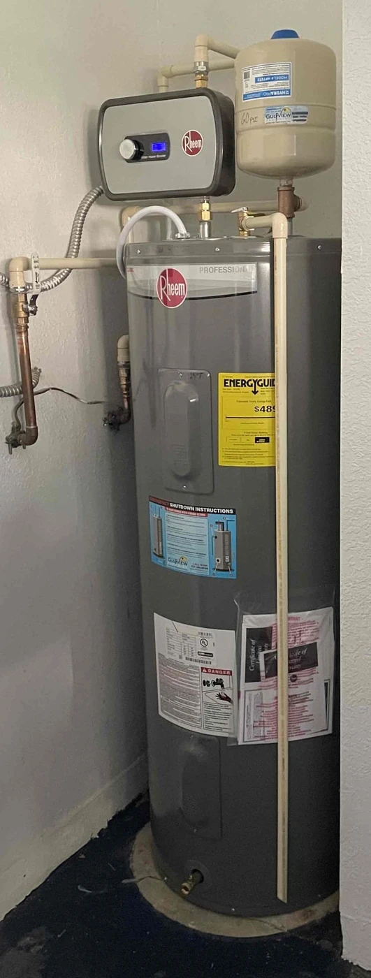 Tank water heater installation with a Rheem tank booster heater and expansion tank in a utility closet