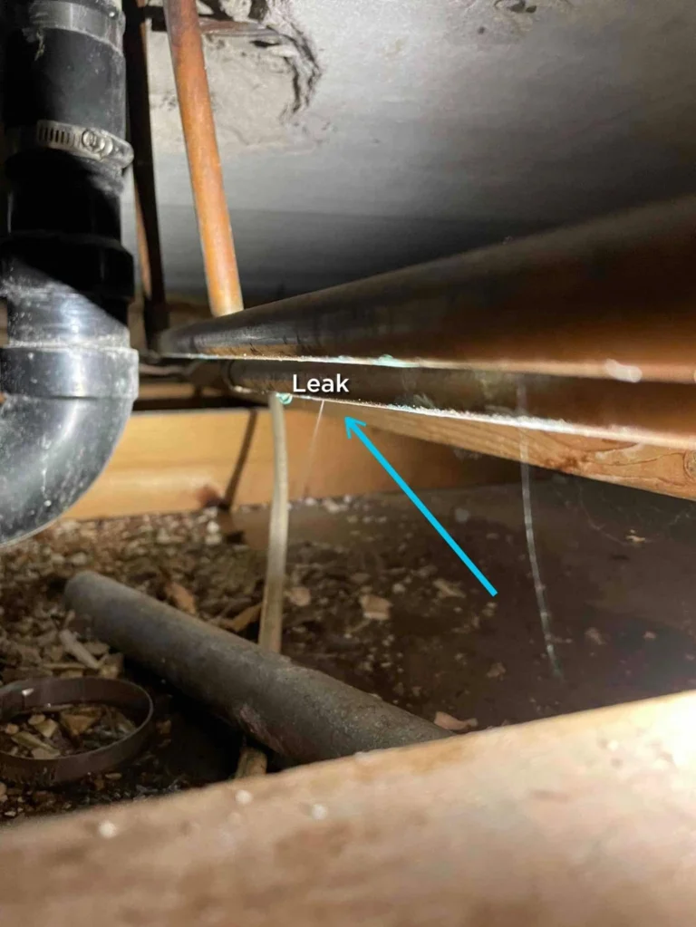 Copper water line with a leak marked by an arrow in the original job photo.