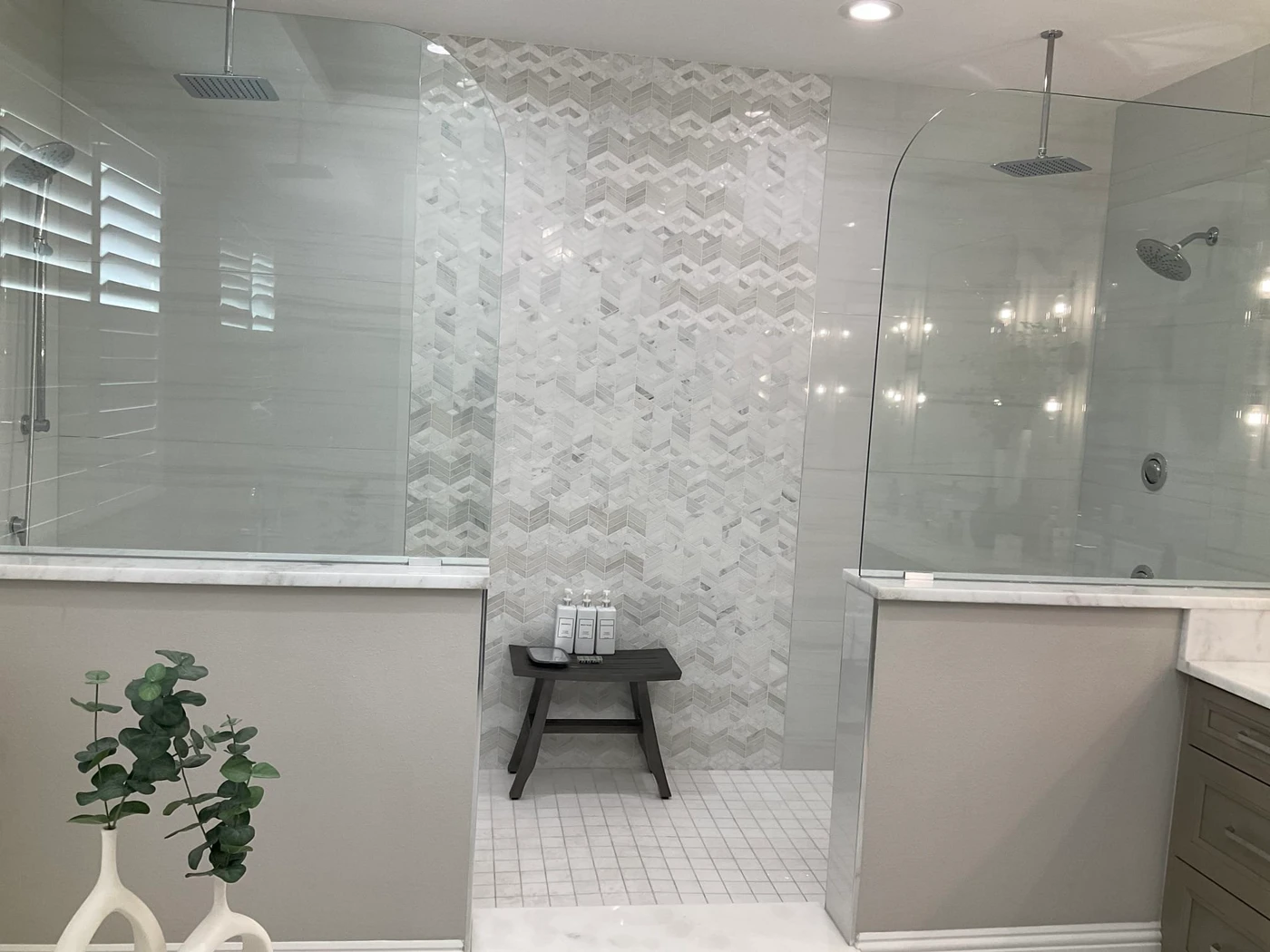 Residential shower with rain heads and wall fixtures installed by Gulfview